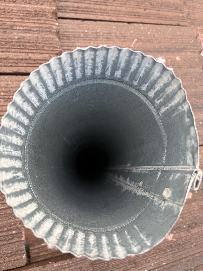 The same dryer vent clean and wide open after cleaning
